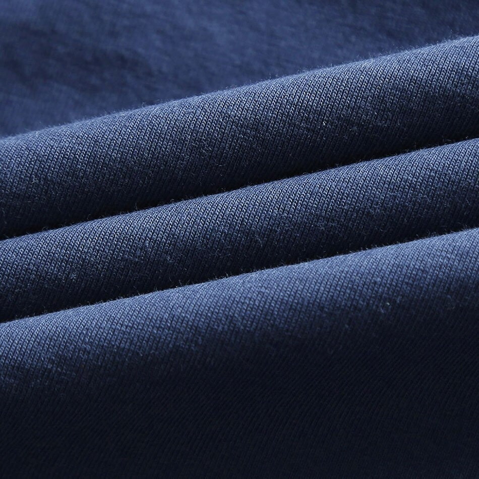 Close-up of soft, dark navy stretch fabric showcasing texture for stylish V neck T-shirt.