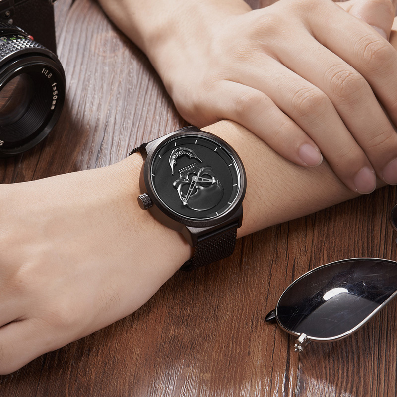 Stylish stainless steel watch with skull design worn on wrist, perfect for rock fashion lovers.