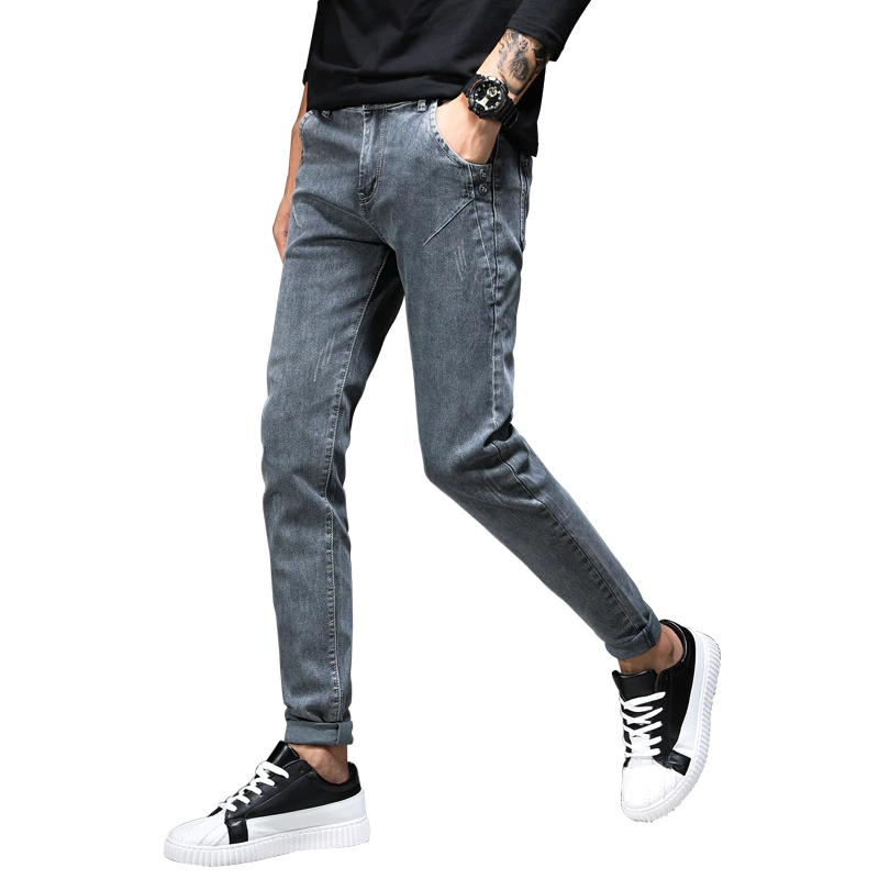 Casual stylish men's slim fit grey jeans paired with trendy sneakers, showcasing a modern streetwear look.
