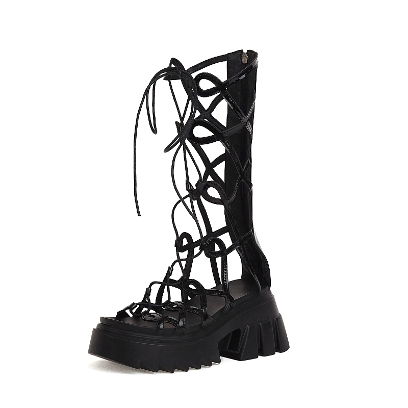 Gothic-inspired black knee-high sandals with unique lace-up design and chunky platform sole for women.