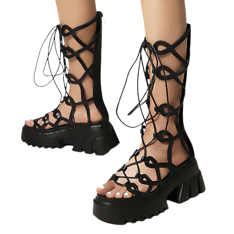 Stylish women's black lace-up sandals with thick platform soles and intricate cross-strap design, perfect for gothic fashion.