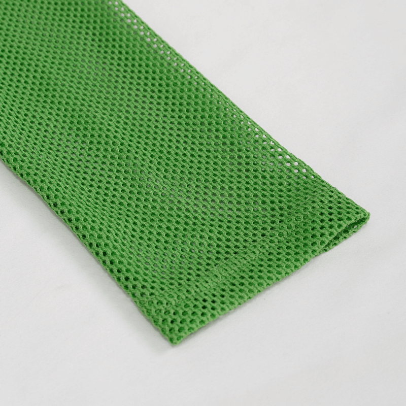 Close-up of stylish women's green sheer mesh fabric, perfect for alternative clothing and trendy outfits.