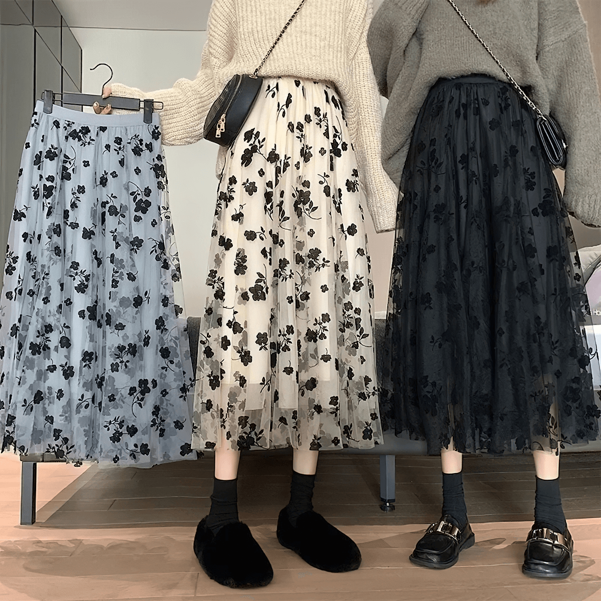 Stylish women's high waist skirts in black, beige, and blue with floral embroidery displayed on models.