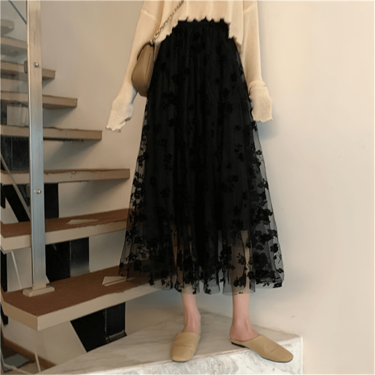 Elegant women's black high waist skirt with embroidered flowers, perfect for casual and stylish outfits.