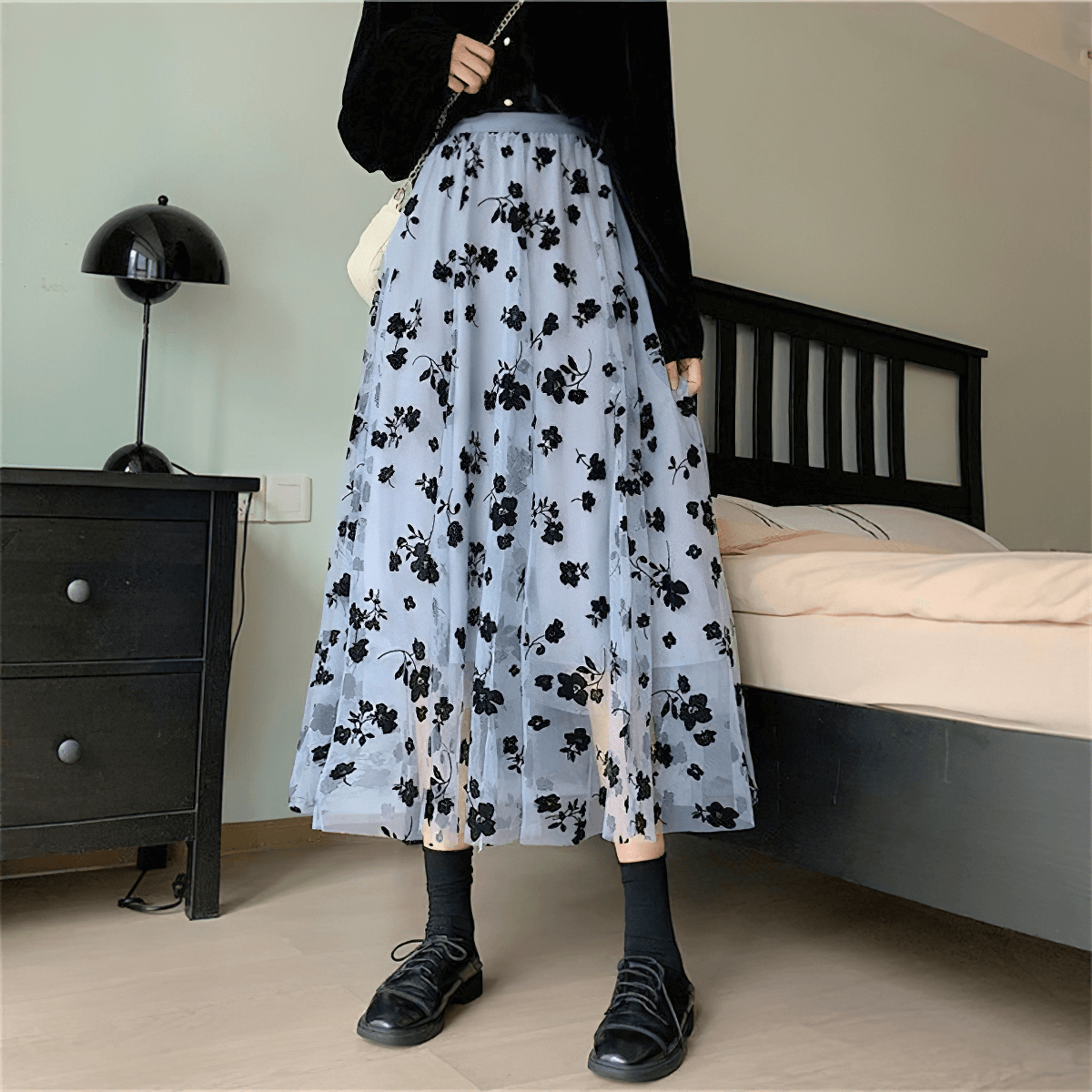 Elegant women's high waist skirt with embroidered black flowers on a mesh tulle fabric, perfect for casual chic outfits.