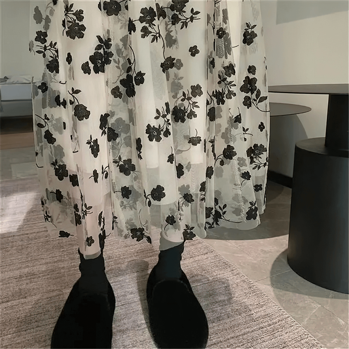 Elegant women's high waist skirt with black embroidered flowers, featuring a sheer mesh tulle overlay.