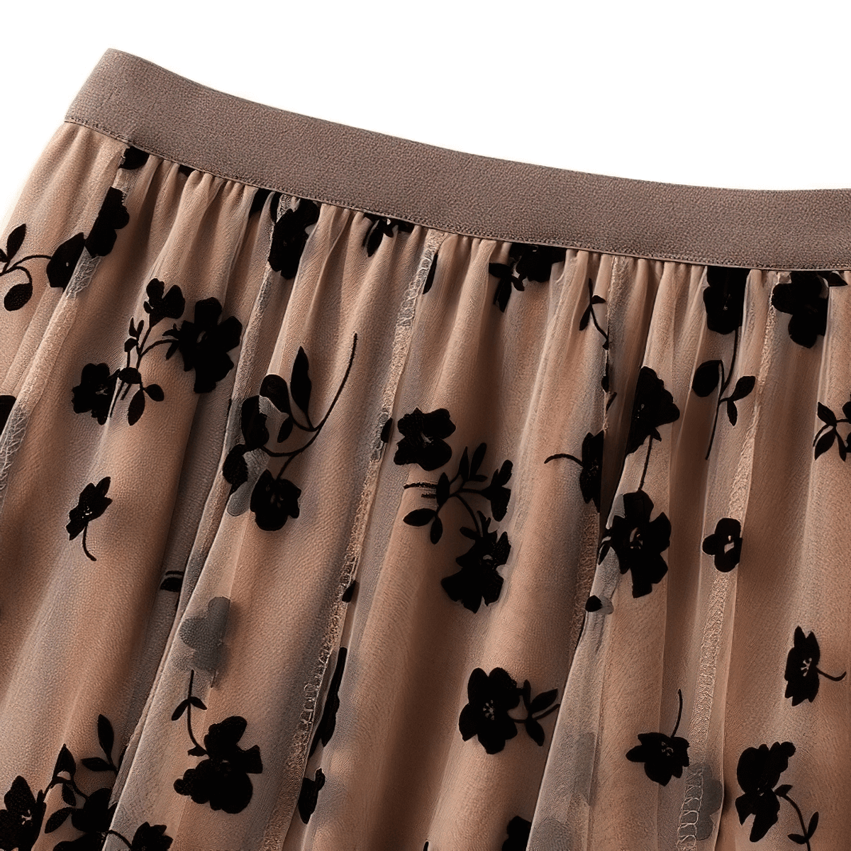 Elegant high waist skirt in beige mesh tulle with black floral embroidery detail, perfect for stylish casual outfits.