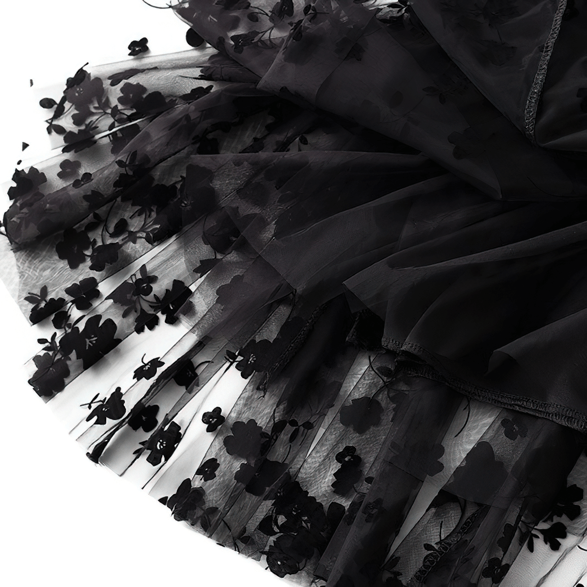 Stylish black mesh tulle women's skirt featuring elegant floral embroidery details.