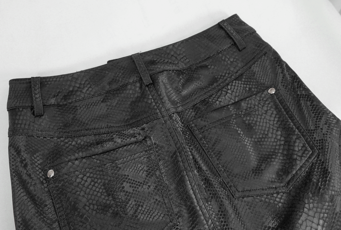 Back view of a stylish women's snakeskin mini skirt showcasing detailed texture and pockets.