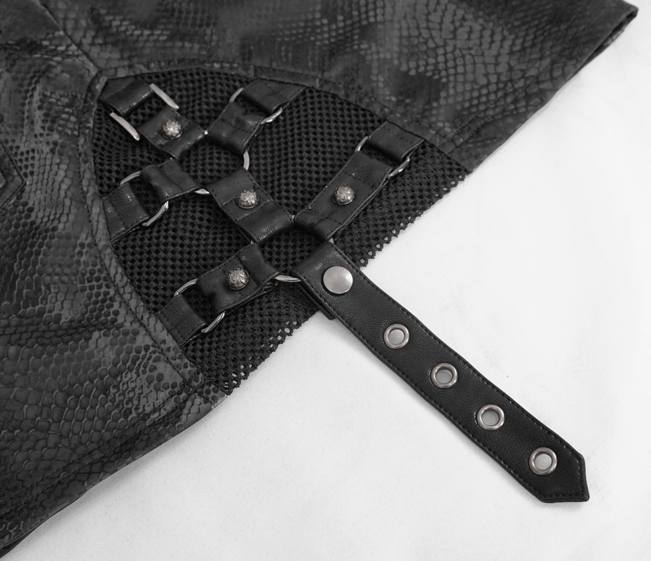 Close-up of stylish women's snakeskin mini skirt with punk details and edgy straps.