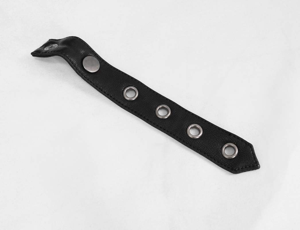 Black leather strap with metal grommets, perfect for punk-style accessories and alternative fashion.