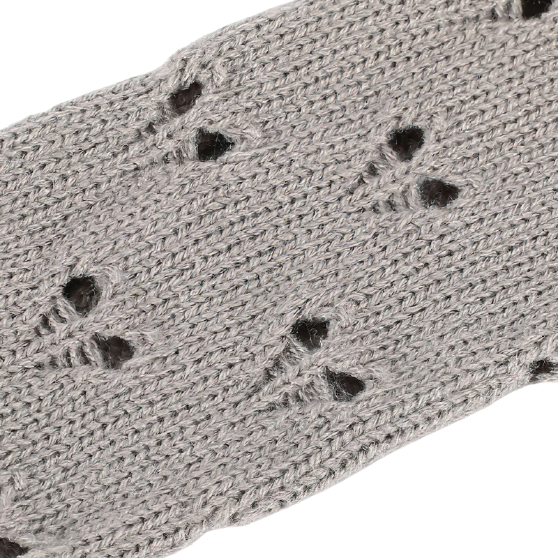 Close-up of stylish women's fingerless gloves with hollow heart pattern in soft grey knit fabric.