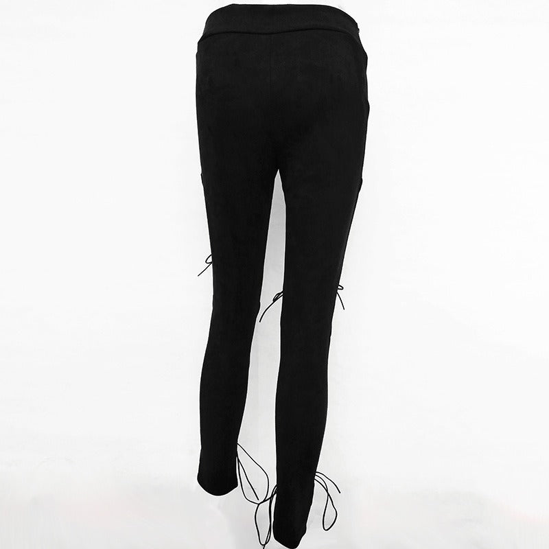 Women's black suede bodycon bandage trousers with lace-up details at the knees, perfect for gothic and rock outfits.