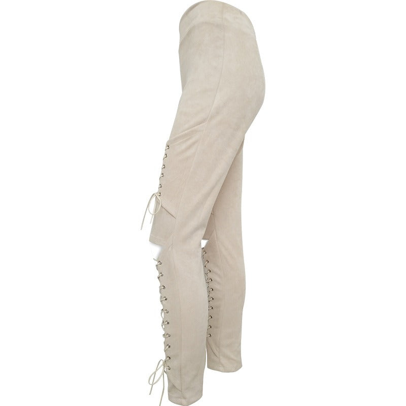 Women's suede bandage trousers with lace-up design on knees, perfect for gothic and rave outfits.