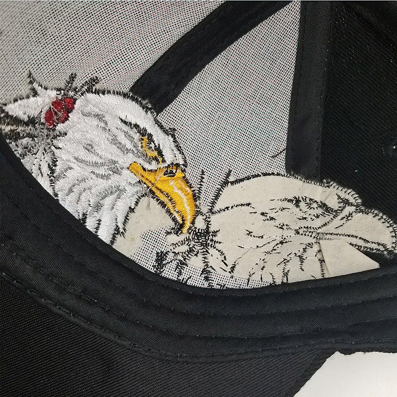Inside view of a black baseball cap featuring an embroidered eagle design, perfect for summer wear.