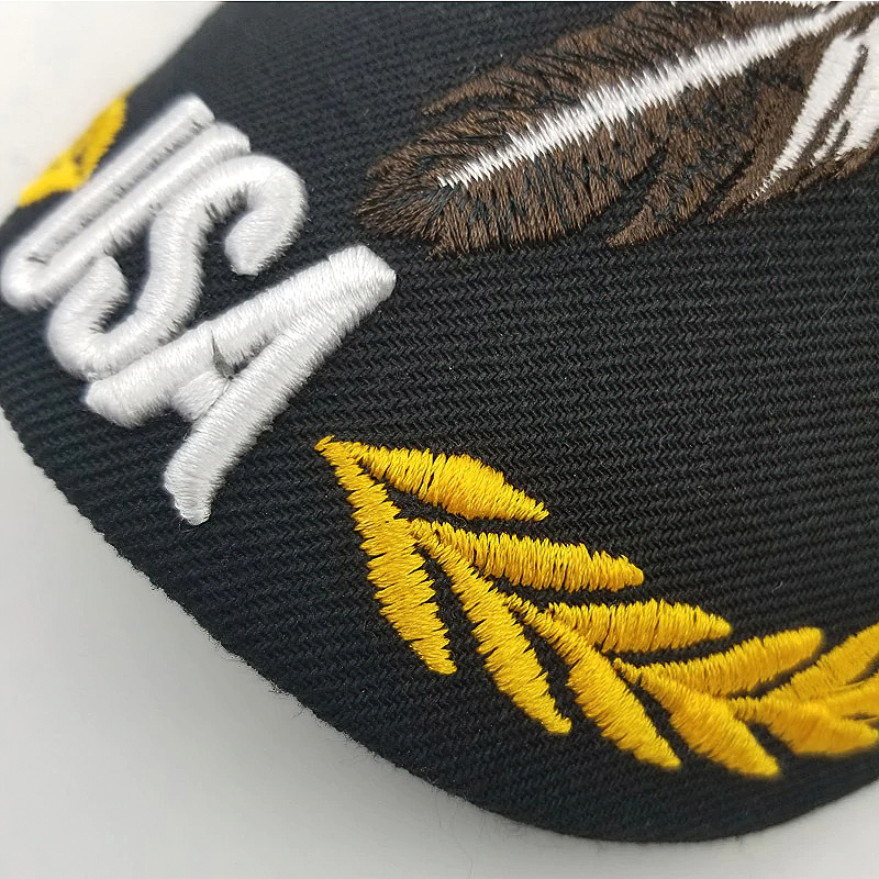 Close-up of a black summer baseball cap with USA embroidery and yellow feather design, perfect for men and women.