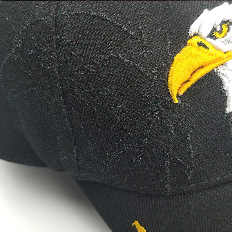 Close-up of black summer baseball cap with eagle embroidery and USA lettering, perfect for men and women.
