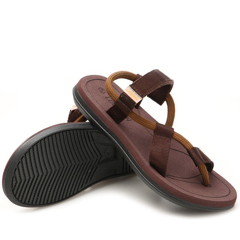Brown unisex gladiator-style flip flop sandals with T-straps, perfect for summer beach days and comfortable casual wear.