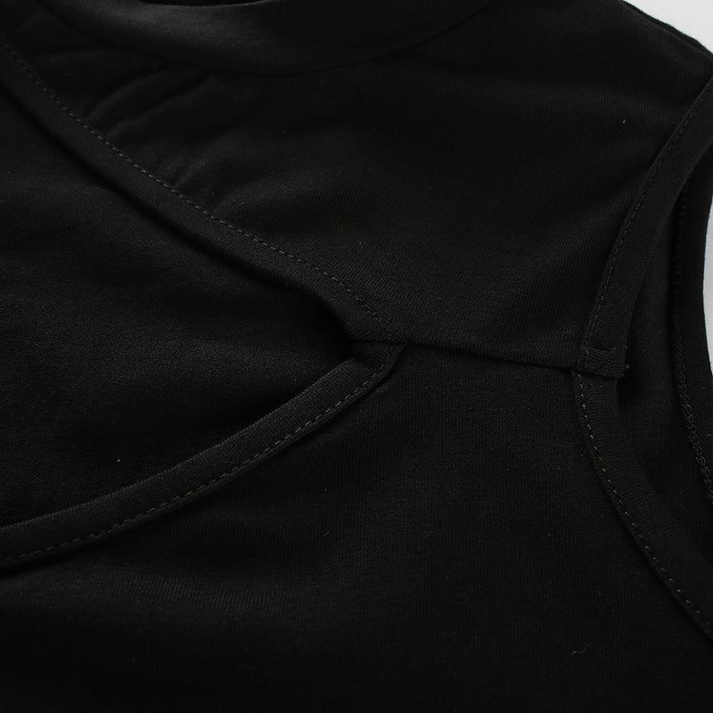Close-up of a black hollow hanging neck crop top showcasing its unique design and soft fabric texture.