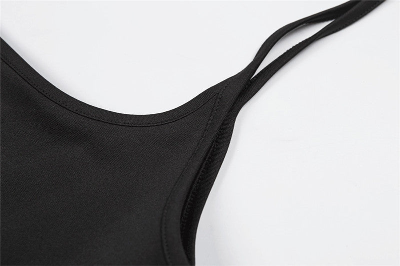 Close-up of the strap detail on a women's black summer skirt in alternative fashion.