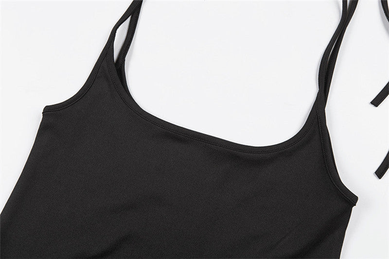 Close-up of women's black skirt with shoulder straps in alternative fashion, made of spandex and polyester.