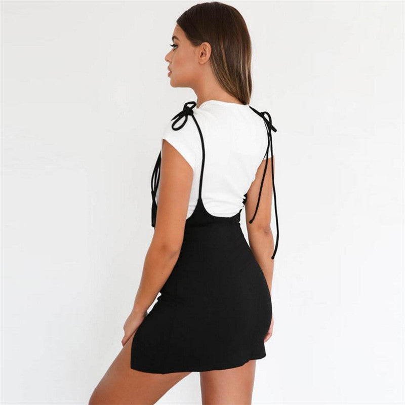 Stylish women’s summer black skirt with shoulder straps, showcasing alternative fashion in a rock style.