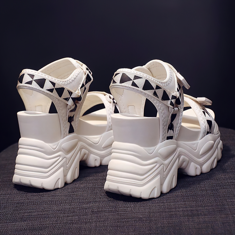 Back view of stylish white platform sandals with black geometric designs, perfect for summer streetwear.