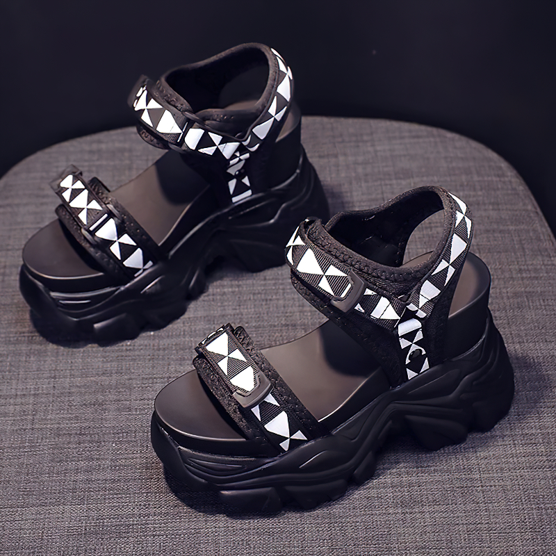 Trendy black platform sandals with white geometric pattern, perfect for summer streetwear and alternative fashion.