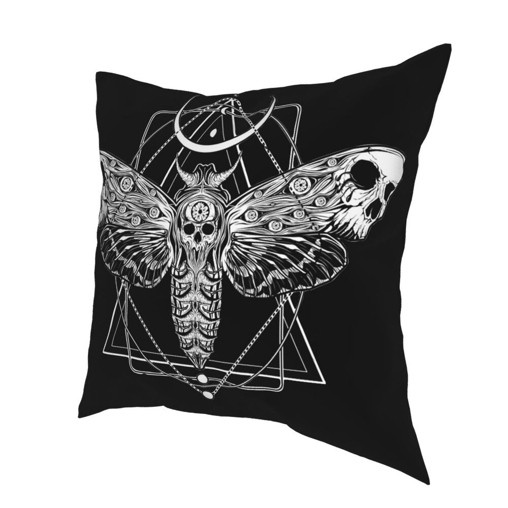 Surreal decorative pillow featuring a skull moth design on a black background, perfect for gothic home decor.
