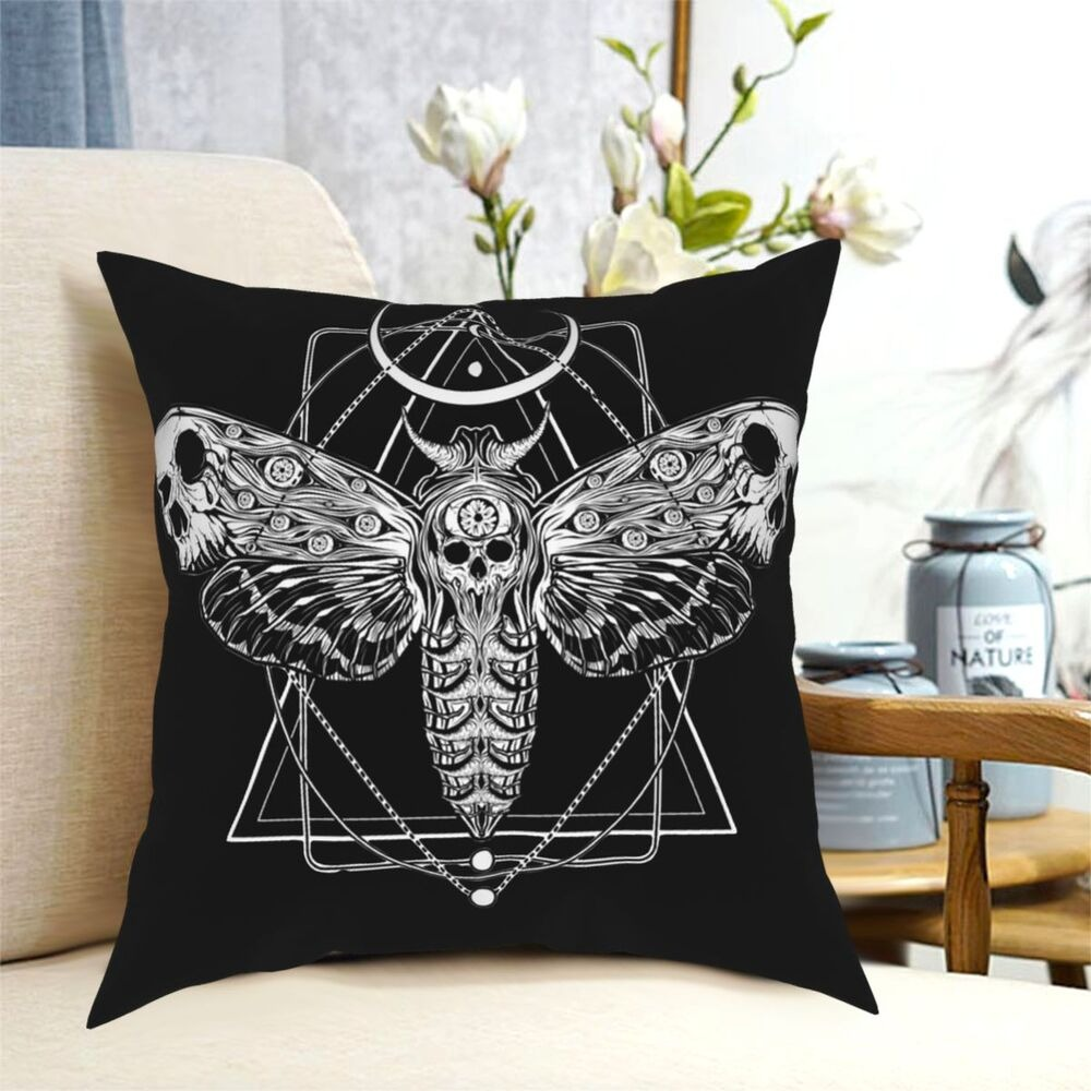 Gothic-style pillow featuring a black and white moth skull design, perfect for adding a spooky touch to home decor.