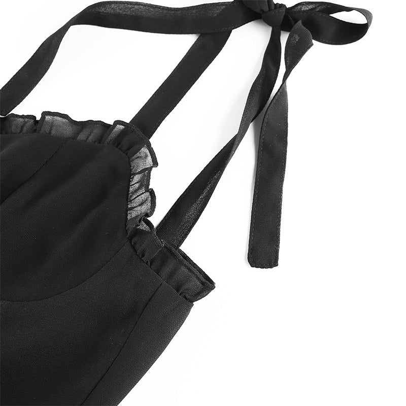 Close-up of black sleeveless dress with bow straps and lace trim, perfect for gothic summer fashion.