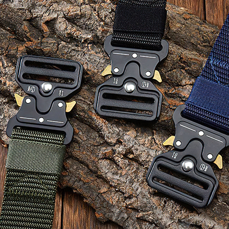 Three tactical nylon belts with metal multifunctional buckles on rustic wood, perfect for outdoor activities and casual wear.