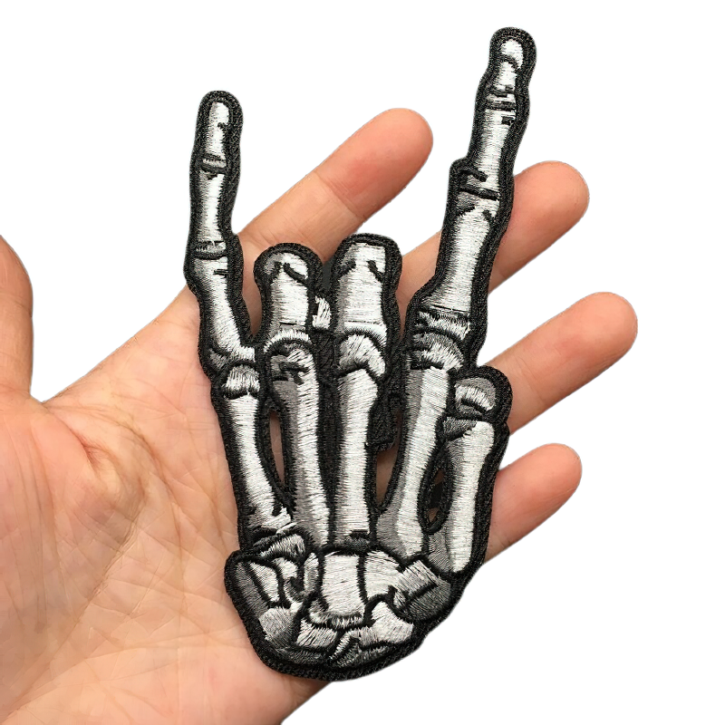 Skeleton hand patch in heavy metal style, perfect for adding a rock touch to your clothes. Unisex casual accessory.