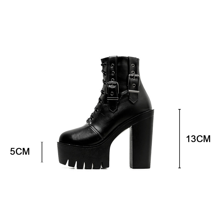 Black lace-up ankle Gothic boots with thick platform and silver buckles, perfect for rocker outfits at concerts.