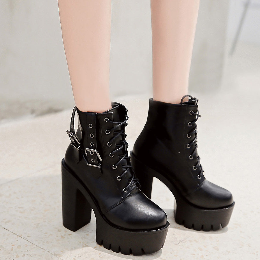 Thick high heel black lace-up ankle boots with buckle, perfect for rocker outfits and concerts.