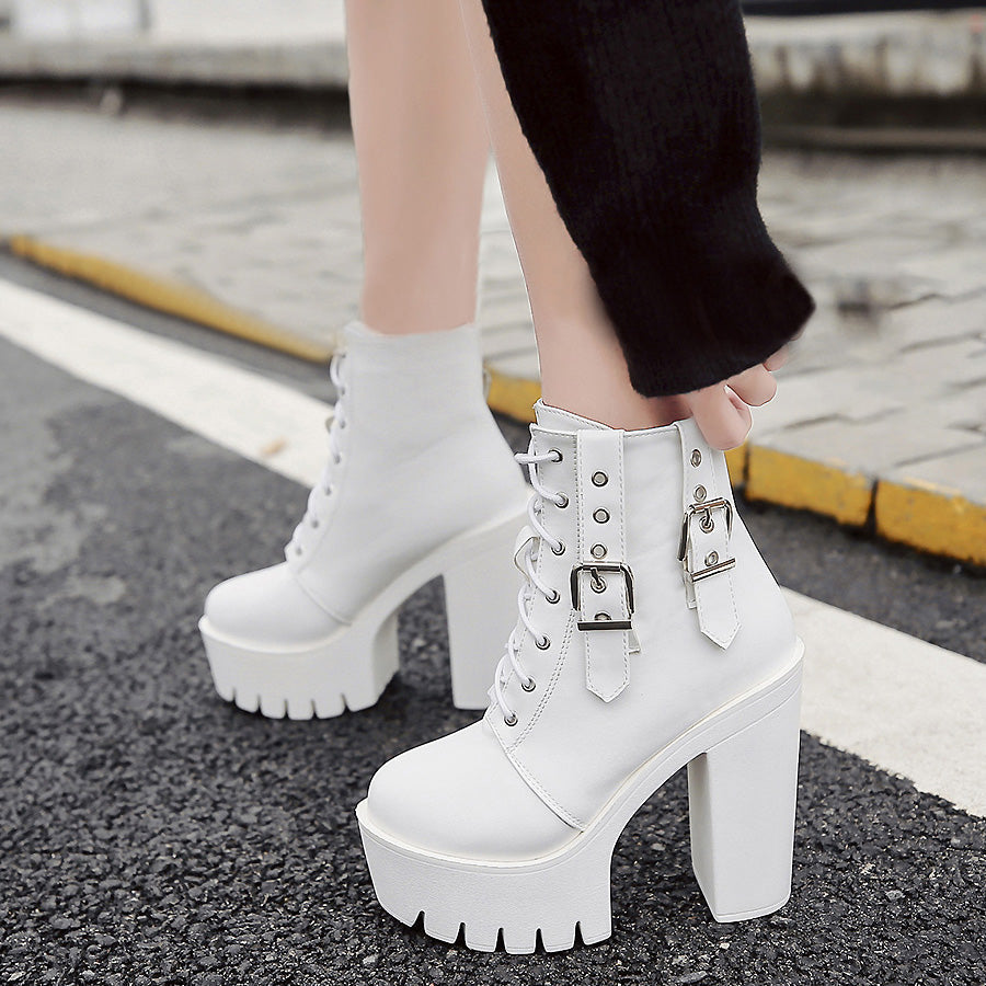 White thick high heels ankle boots with lacing and buckles, perfect for rocker outfits and concerts.