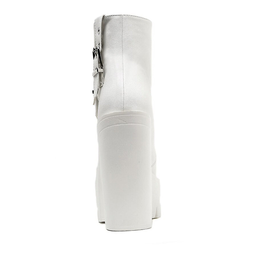 Stylish white thick high heels ankle boots with buckle, perfect for rocker outfits and concerts.