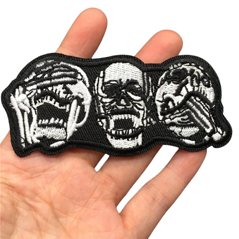 Unisex alternative fashion patch featuring three crazy skulls, perfect for adding edgy style to clothes.