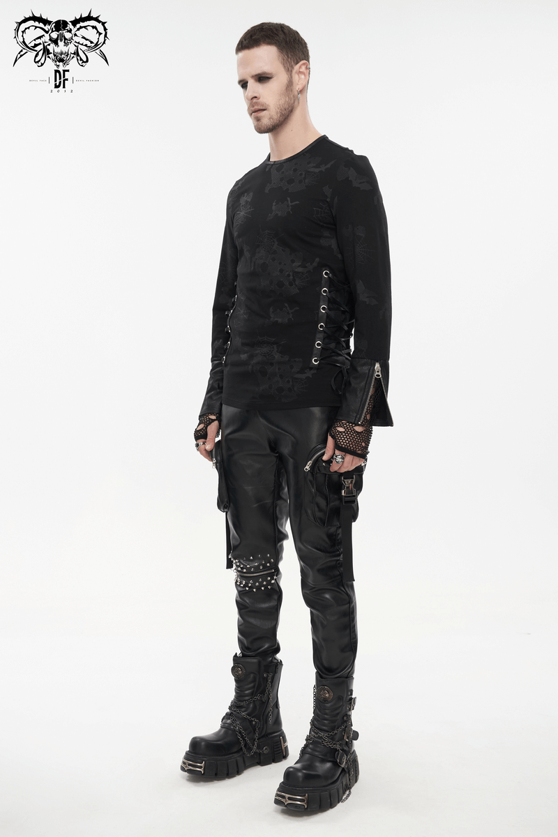 Men's gothic black sweatshirt with spider web print, paired with stylish leather pants and chunky boots.
