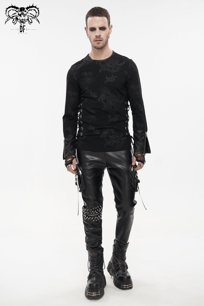 Trendy gothic men's black sweatshirt with skull print, paired with slick leather pants and bold accessories.
