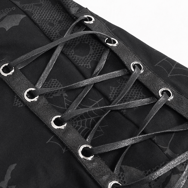 Close-up of black sweatshirt lace-up detail with spider web and bat print, showcasing gothic fashion elements.