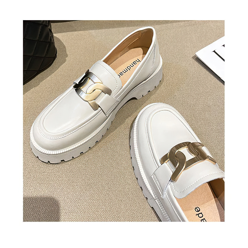 Trendy thick-soled white leather loafers for women with gold chain detail on top, perfect for casual outfits.