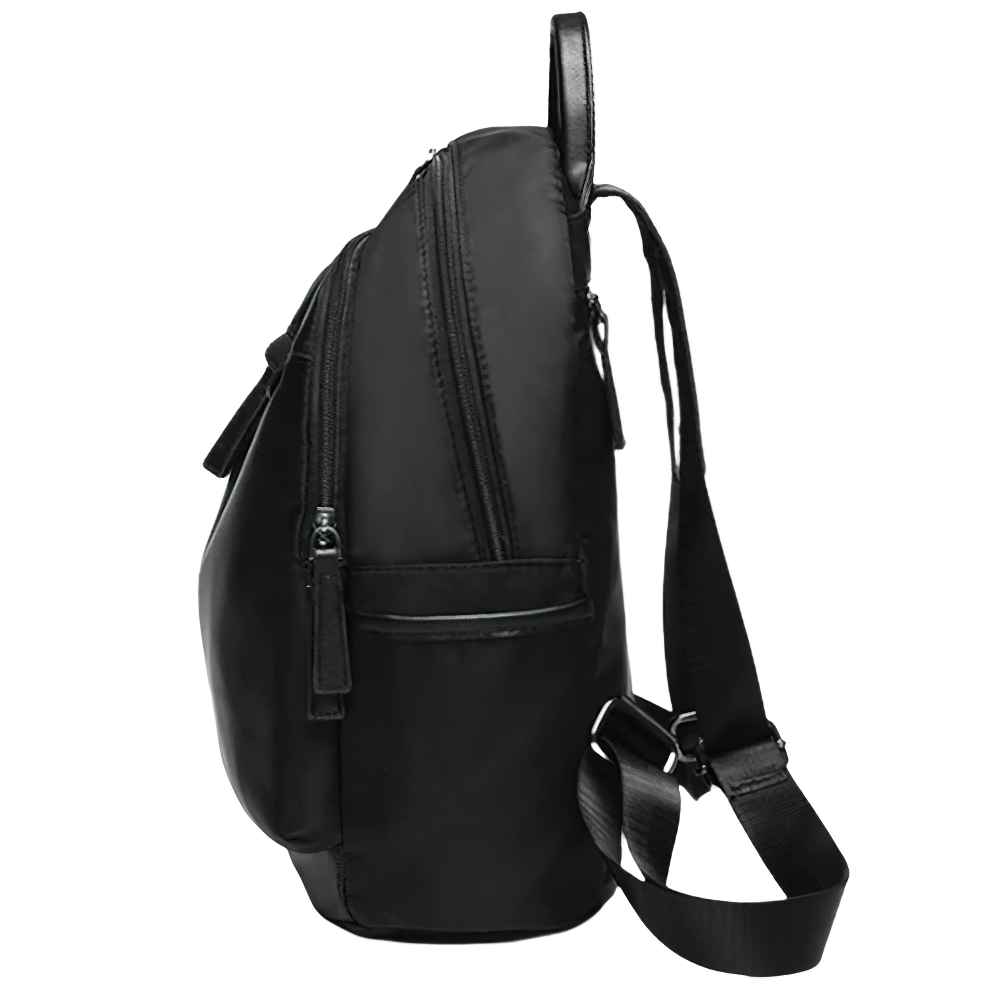 Stylish black Oxford cloth backpack for women, featuring multiple pockets and a sleek design, perfect for casual outings.