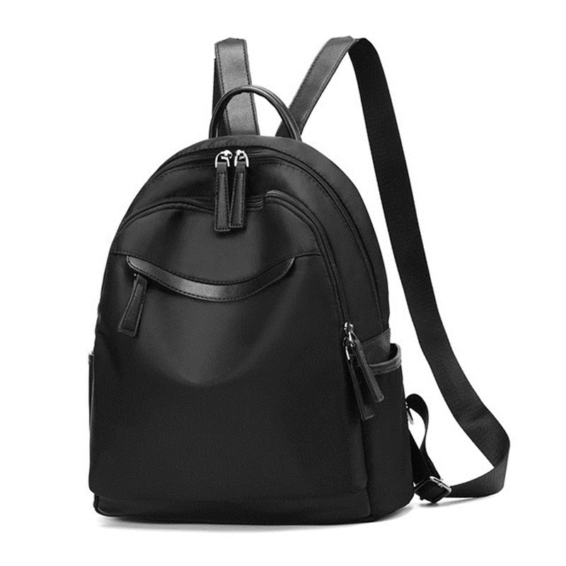 Trendy black backpack for women, casual Oxford-style daypack with multiple pockets and zippers.