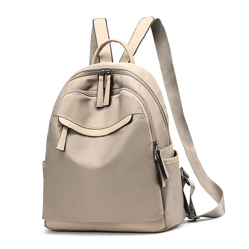 Trendy women's casual Oxford cloth backpack in beige, featuring multiple pockets and stylish design for everyday use.