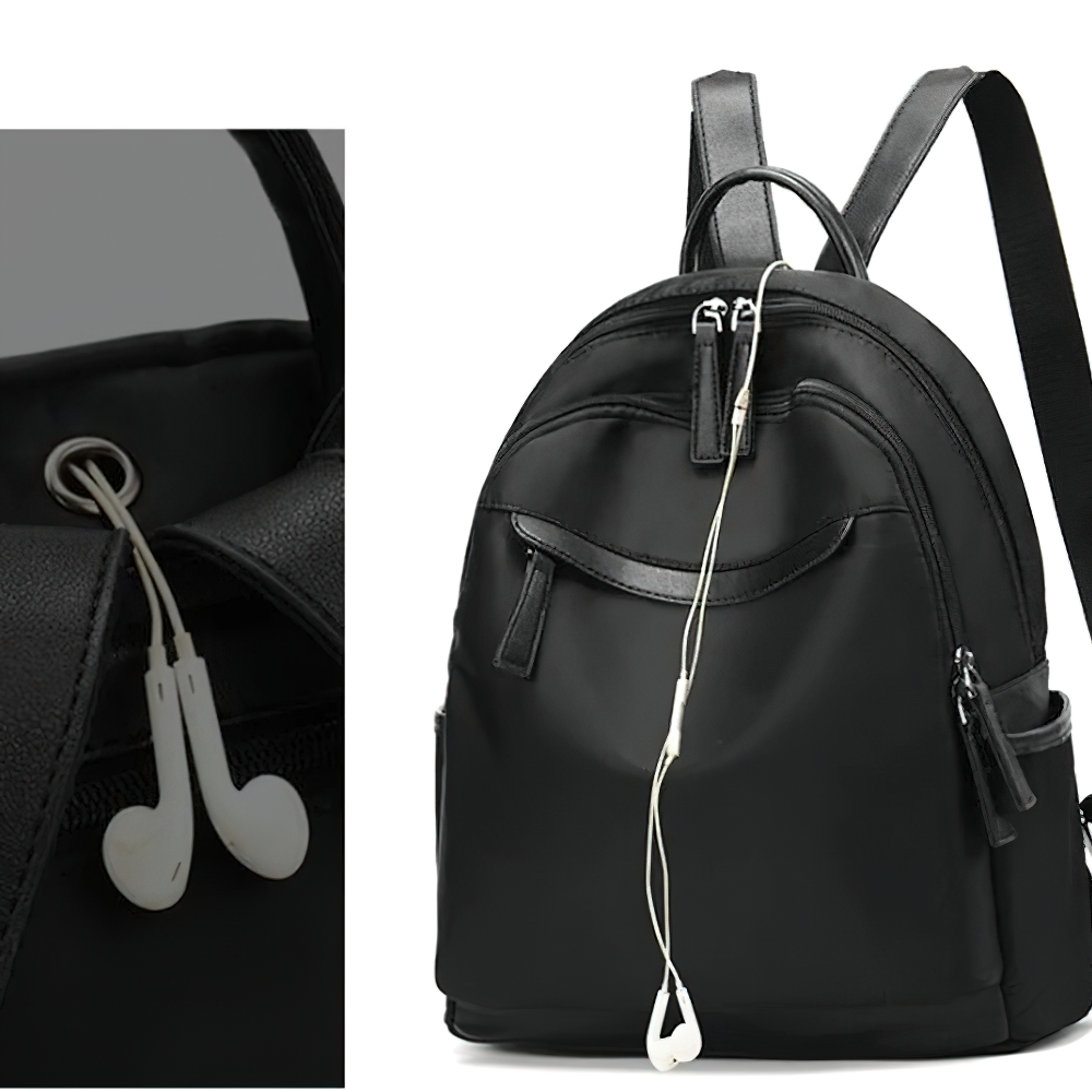 Stylish black casual backpack featuring earphone outlet and multiple pockets for convenience.