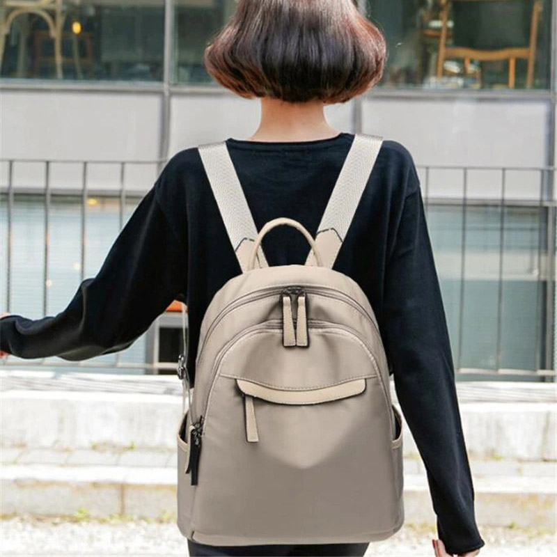 Trendy casual women's oxford cloth backpack in beige, perfect for daily use with comfortable straps.