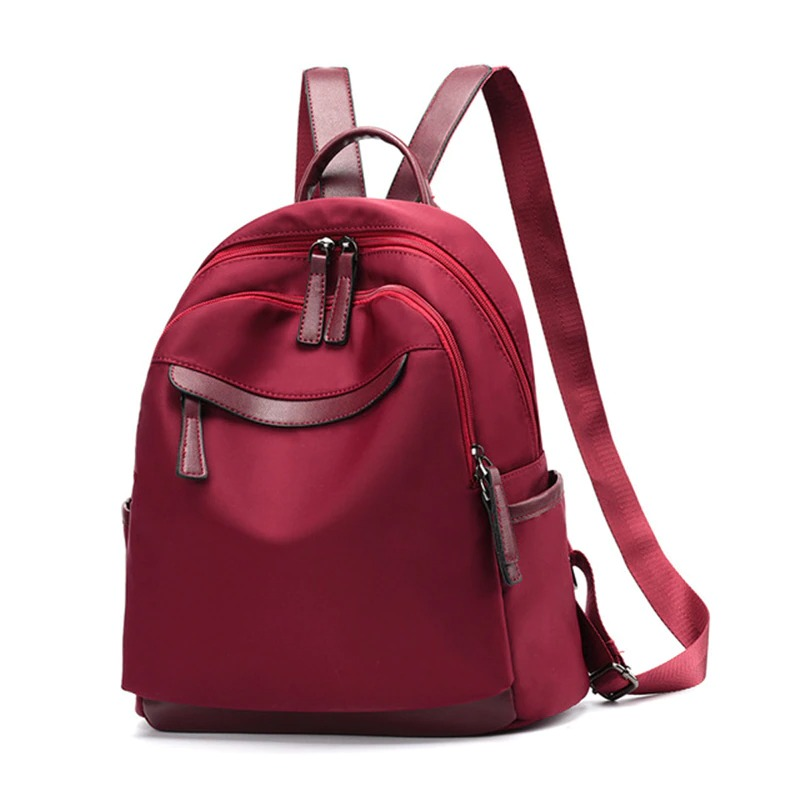 Trendy burgundy casual Oxford cloth backpack for women with multiple pockets and stylish design.
