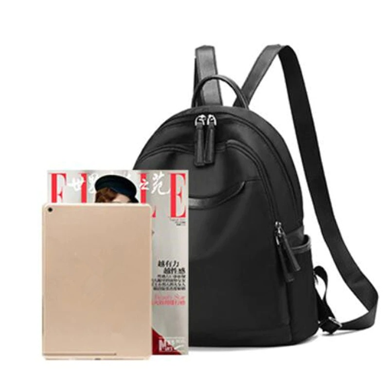 Stylish black Oxford cloth backpack for women with magazine and tablet, perfect for casual outings and everyday use.
