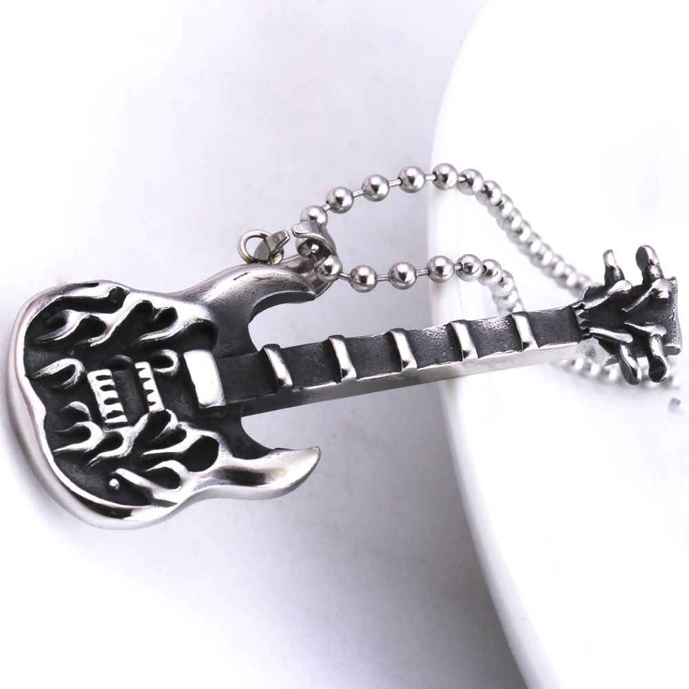 Trendy silver guitar pendant necklace on a chain, perfect for music lovers and punk style enthusiasts.